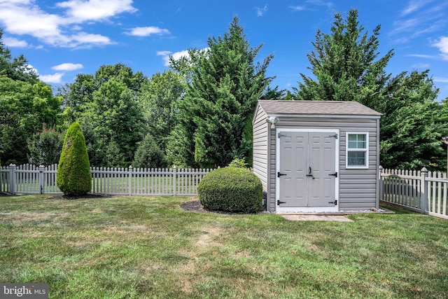 view of shed featuring a fenced backyard