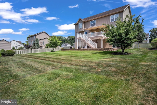 view of yard with stairs and fence