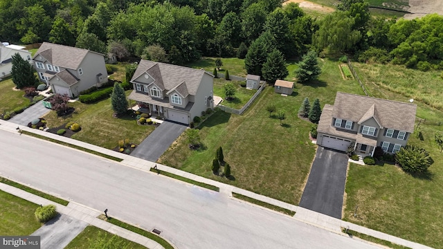 birds eye view of property with a residential view