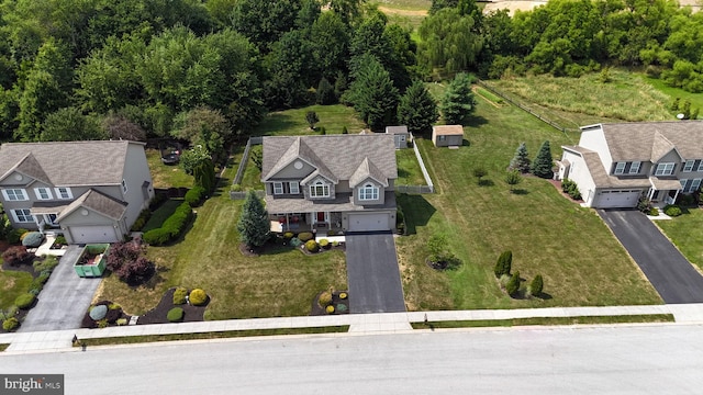 birds eye view of property with a residential view