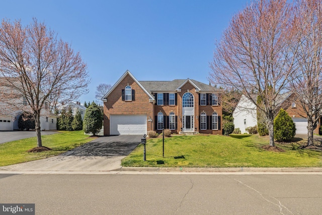 view of front facade featuring brick siding, a front yard, aphalt driveway, and an attached garage
