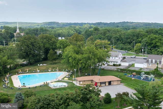 drone / aerial view with a view of trees