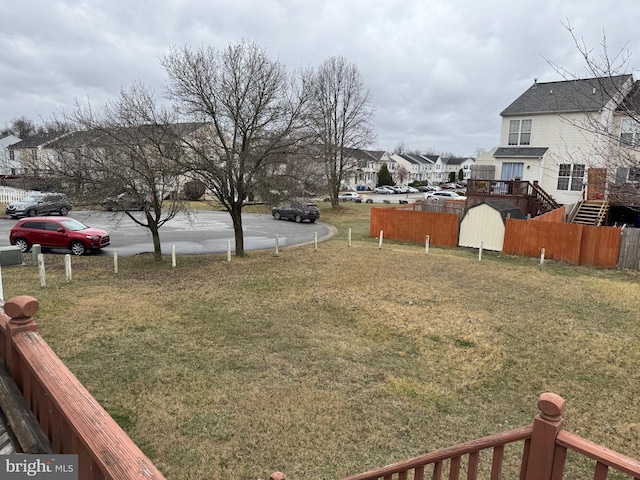 view of yard featuring a residential view and fence