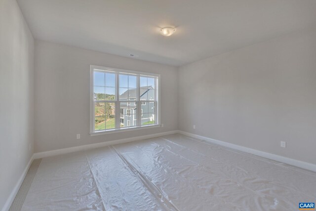 empty room with baseboards