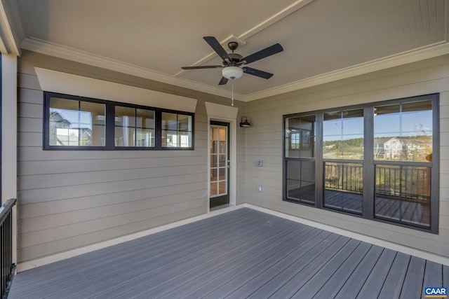 wooden terrace featuring a ceiling fan