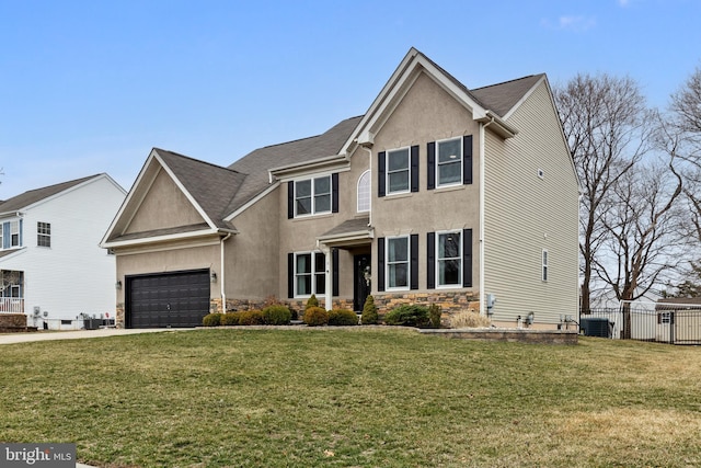 traditional-style home with stucco siding, a front lawn, stone siding, central AC, and fence