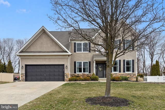 view of front of house with fence, stone siding, and stucco siding