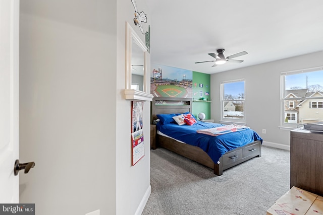 bedroom with baseboards, ceiling fan, and carpet flooring