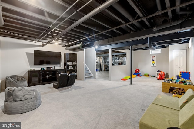 finished basement with stairs and carpet floors