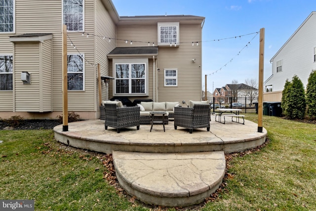 rear view of house featuring a yard, fence, outdoor lounge area, and a patio area