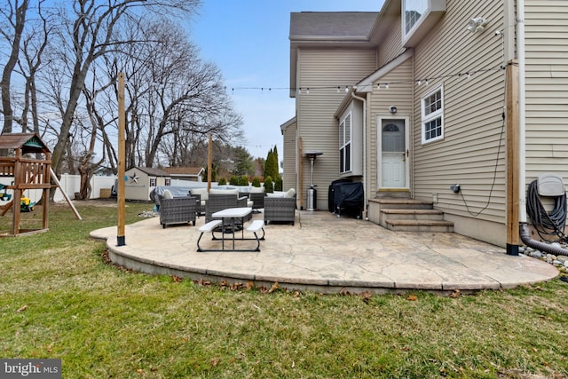 view of patio with fence, an outdoor living space, area for grilling, entry steps, and a playground