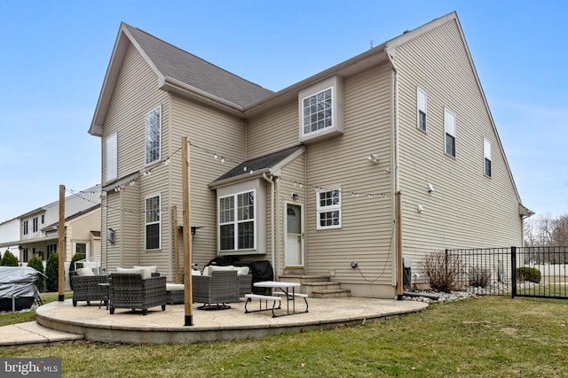 back of house featuring entry steps, outdoor lounge area, a patio, and fence