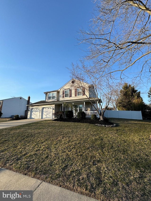 view of front of home featuring a front lawn, fence, covered porch, concrete driveway, and a garage