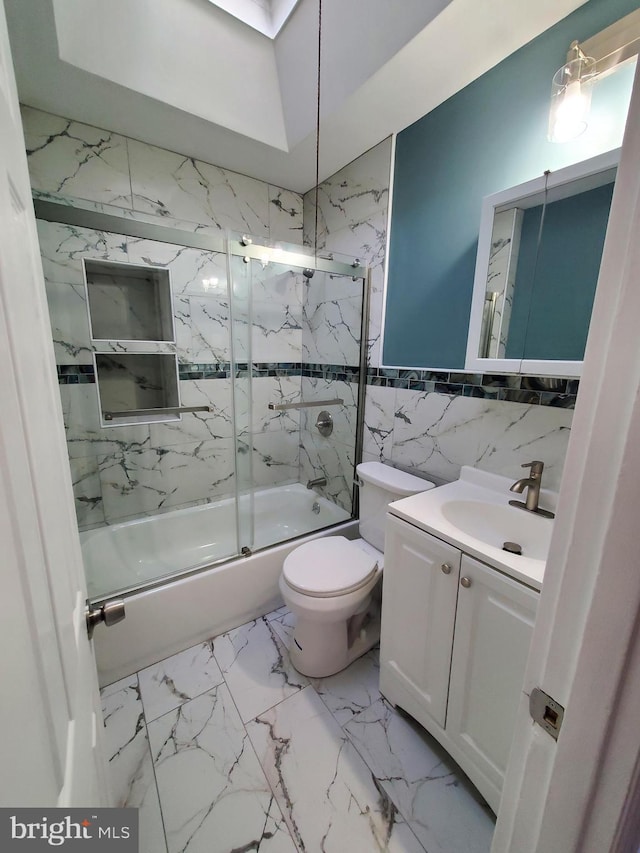 full bath with vanity, enclosed tub / shower combo, tile walls, toilet, and marble finish floor