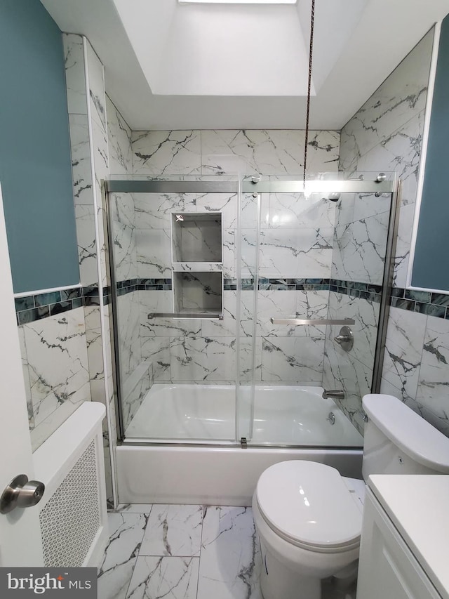 full bathroom with combined bath / shower with glass door, marble finish floor, toilet, and tile walls