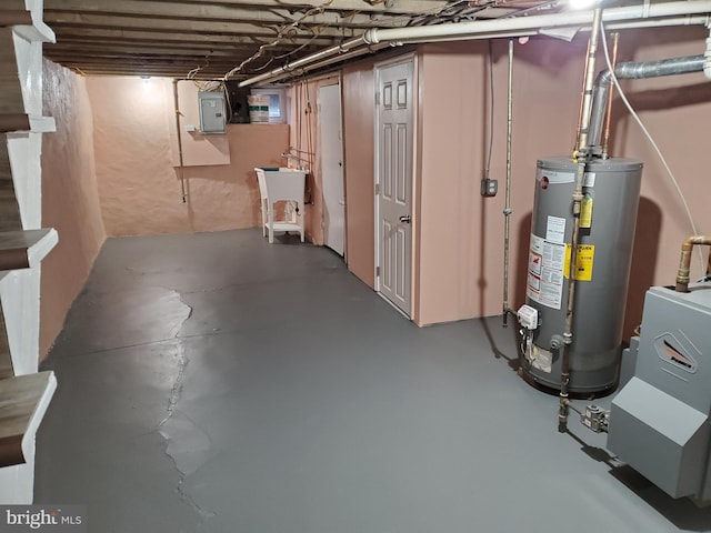 unfinished basement with electric panel, water heater, and a sink