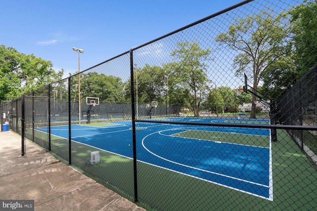 view of sport court featuring community basketball court and fence