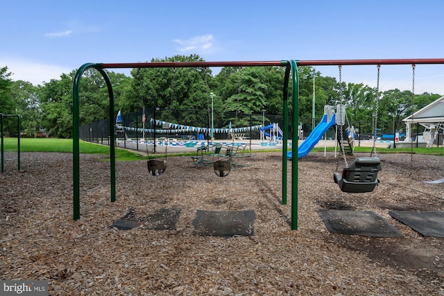 communal playground featuring fence