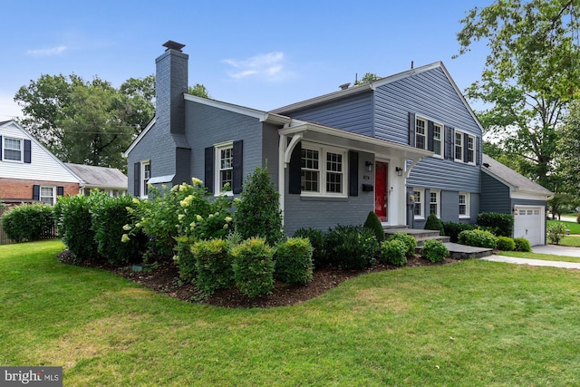 split level home with brick siding, a garage, a front lawn, and a chimney