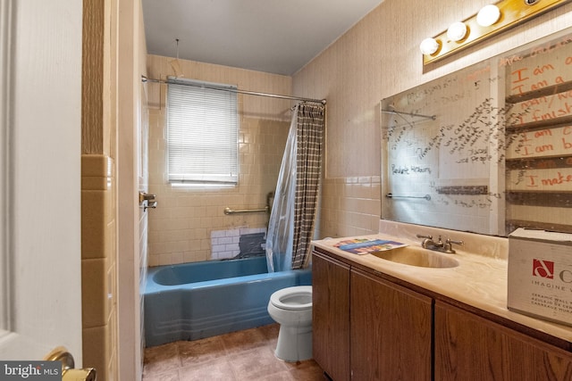 full bathroom with vanity, tile walls, shower / tub combo, and toilet