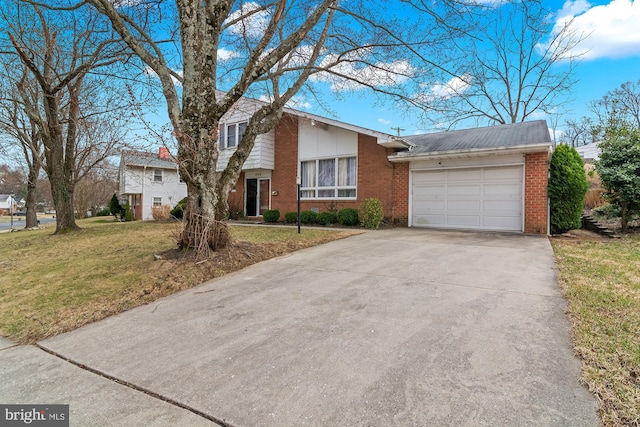 view of front facade with a front lawn, brick siding, concrete driveway, and an attached garage