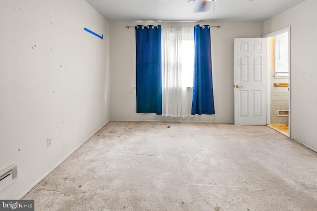 carpeted spare room with visible vents