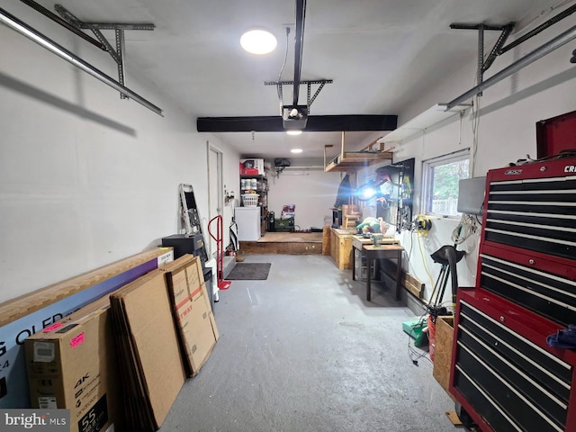 garage featuring a workshop area and a garage door opener