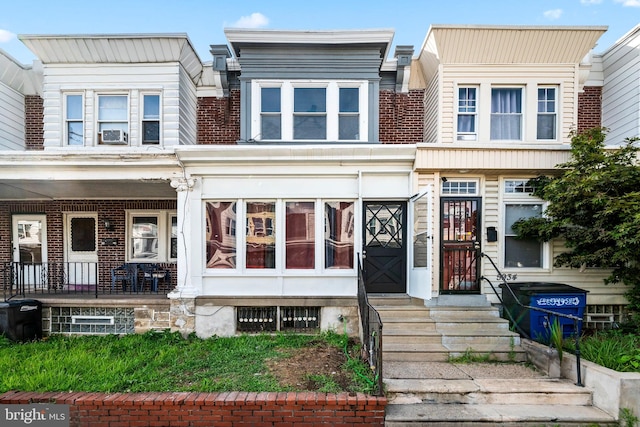 townhome / multi-family property with brick siding