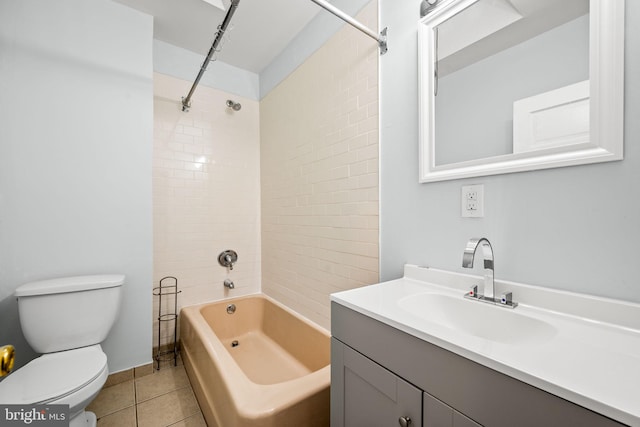 full bathroom with vanity, tile patterned floors, toilet, and washtub / shower combination