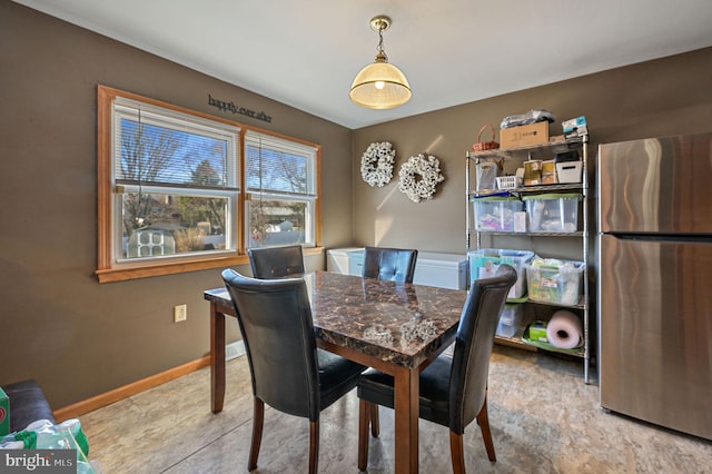 dining room featuring baseboards