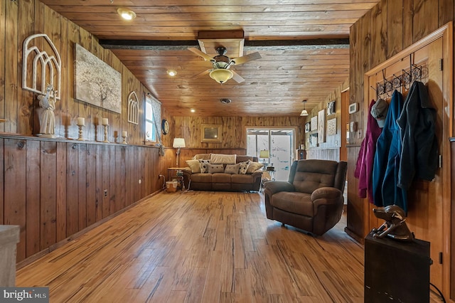 living room with wood finished floors, wooden ceiling, and a ceiling fan