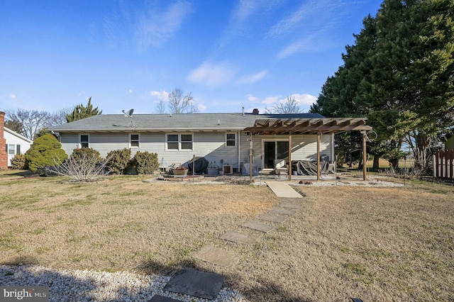 back of property with a patio, a lawn, and a pergola