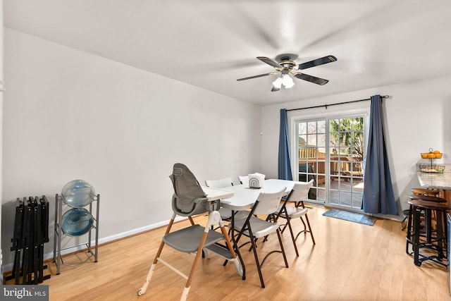 dining room with a ceiling fan, light wood-type flooring, and baseboards