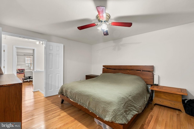 bedroom featuring light wood-type flooring and ceiling fan