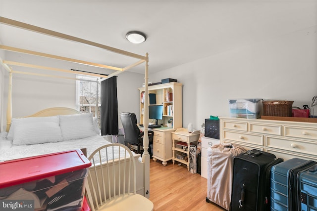 bedroom featuring light wood-style floors