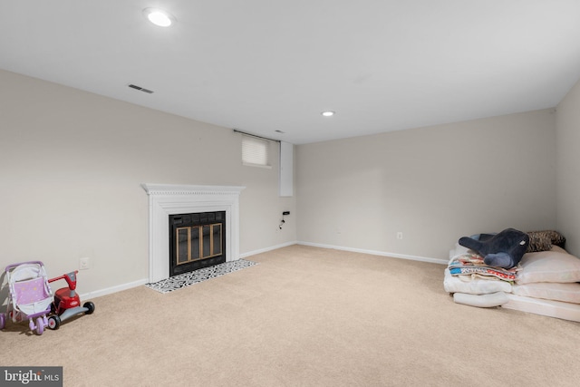 interior space with recessed lighting, visible vents, baseboards, and a fireplace with flush hearth