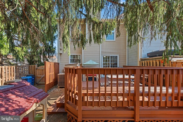 deck with central air condition unit and fence