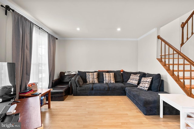 living room with recessed lighting, light wood-type flooring, ornamental molding, and stairway