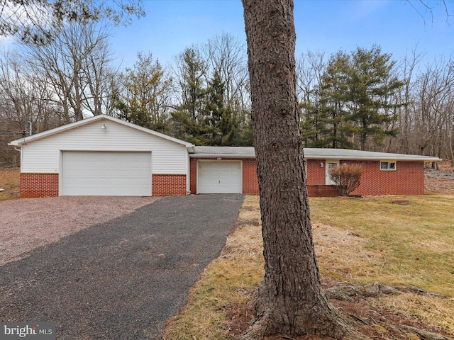 ranch-style home with a front lawn and brick siding