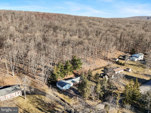 drone / aerial view with a view of trees