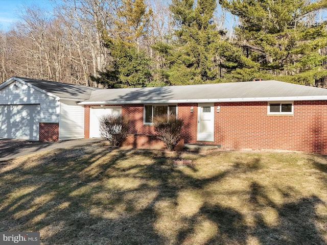 single story home with brick siding and a front lawn