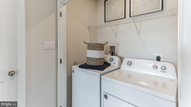 washroom featuring washer and dryer and laundry area