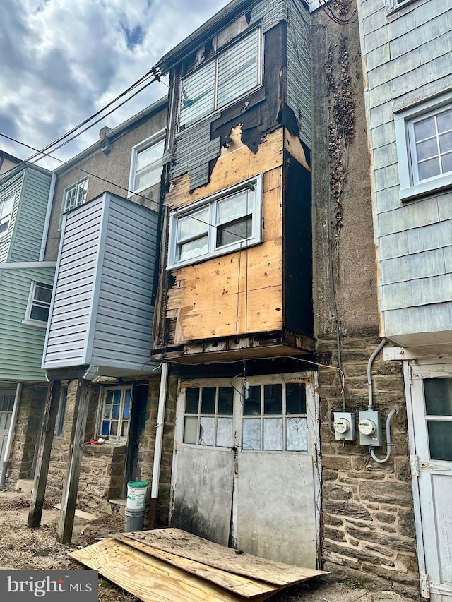 view of side of property featuring stone siding