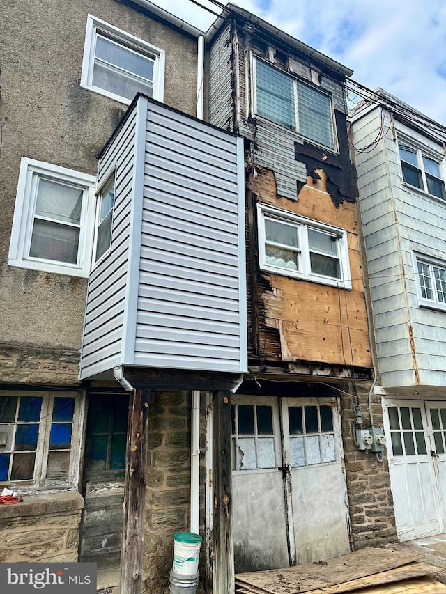 view of home's exterior featuring stone siding