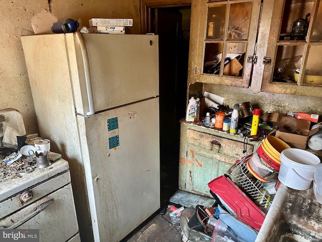 kitchen featuring freestanding refrigerator