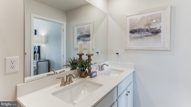 bathroom with double vanity and a sink