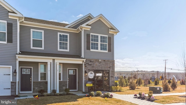 view of property with stone siding