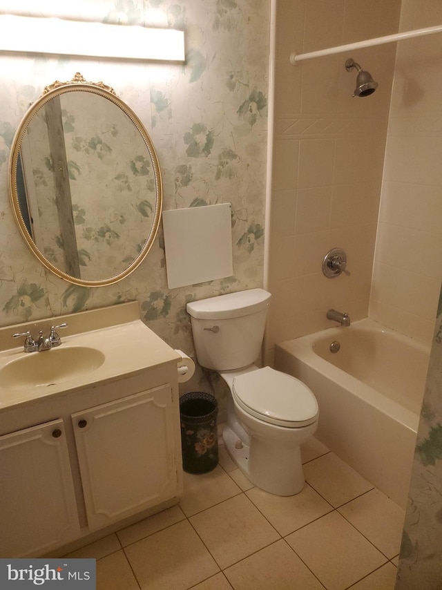 full bathroom featuring vanity, bathing tub / shower combination, wallpapered walls, tile patterned floors, and toilet