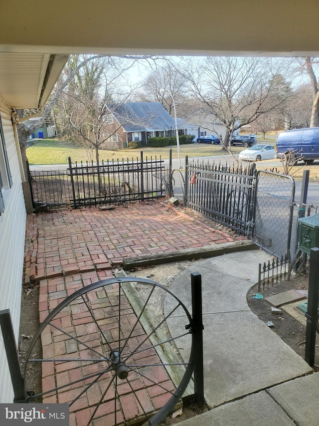 view of patio / terrace featuring fence