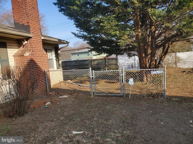 view of yard with a gate and fence